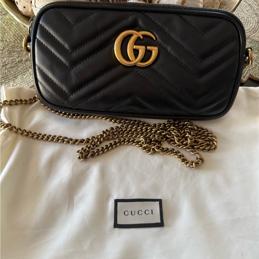 Gucci Classic Beautiful Black Marmont Crossbody Pouchette with Gold chain.